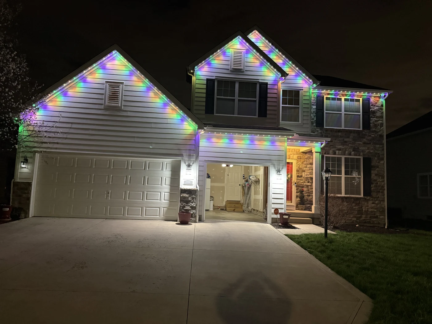 Permanent warm white lights on home at night in Columbus