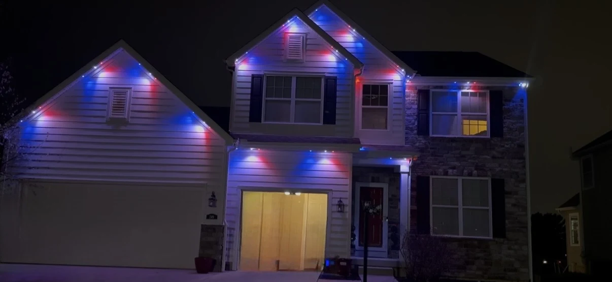 Purple permanent lights on home at night