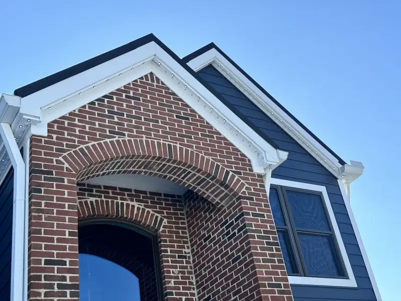 Closeup of permanent light installation on home soffit