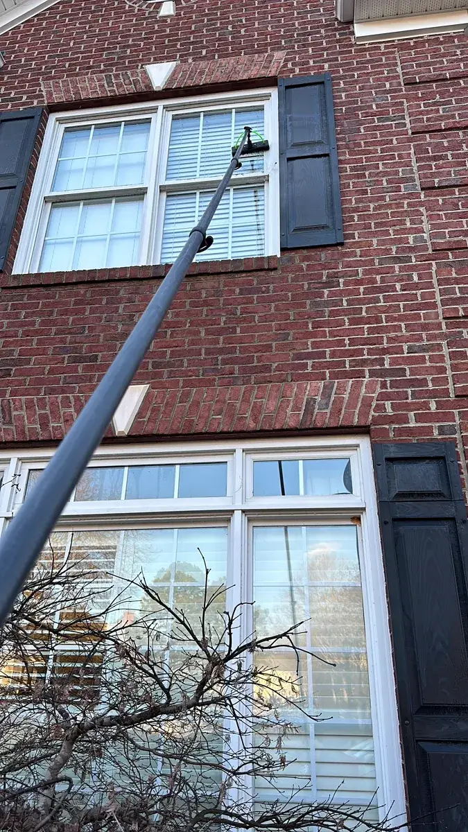 Window cleaning on brick house in Columbus Ohio